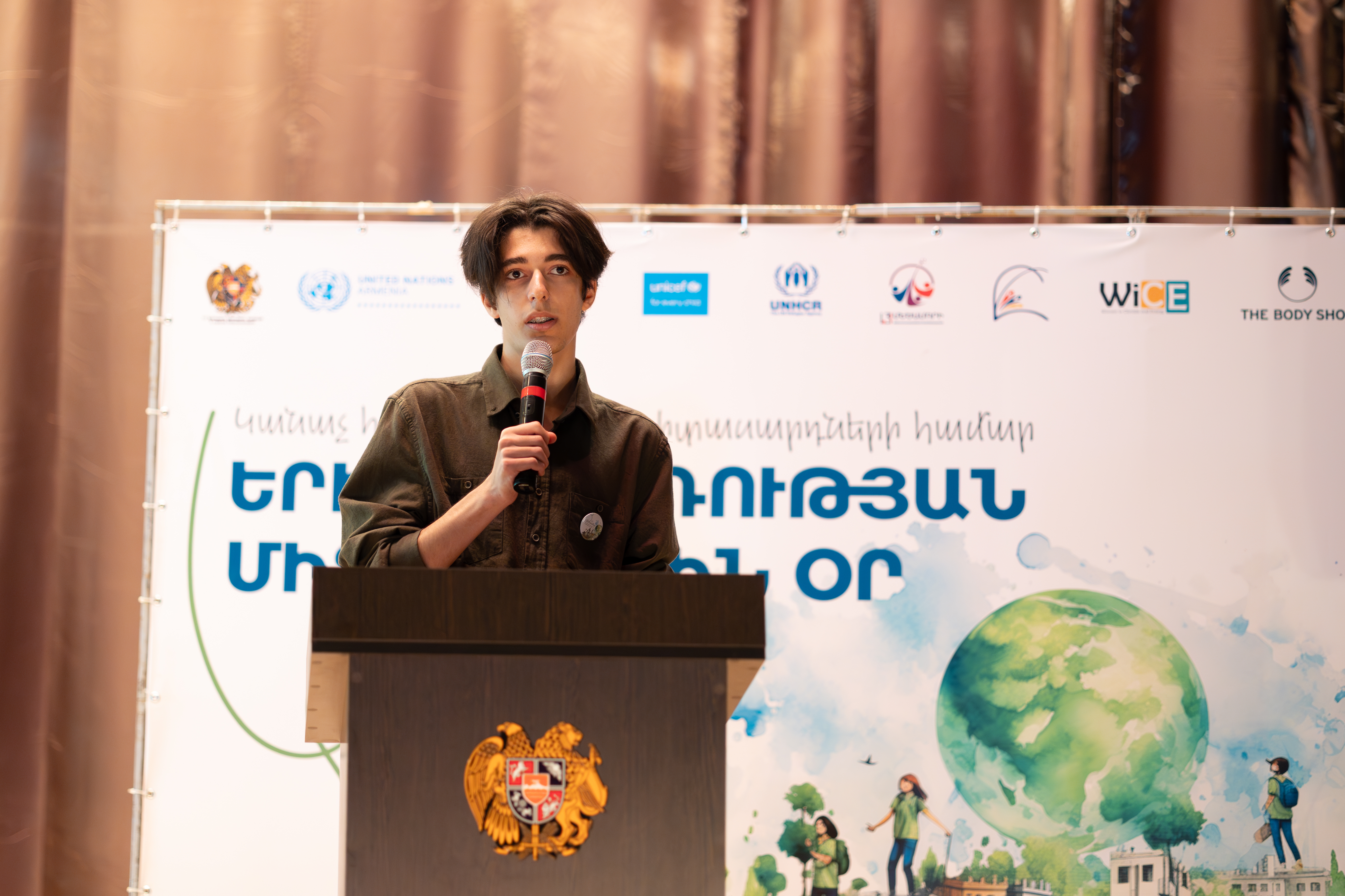 Pargev Poghosyan, a Metsamor youth representative welcomes the event  guests 