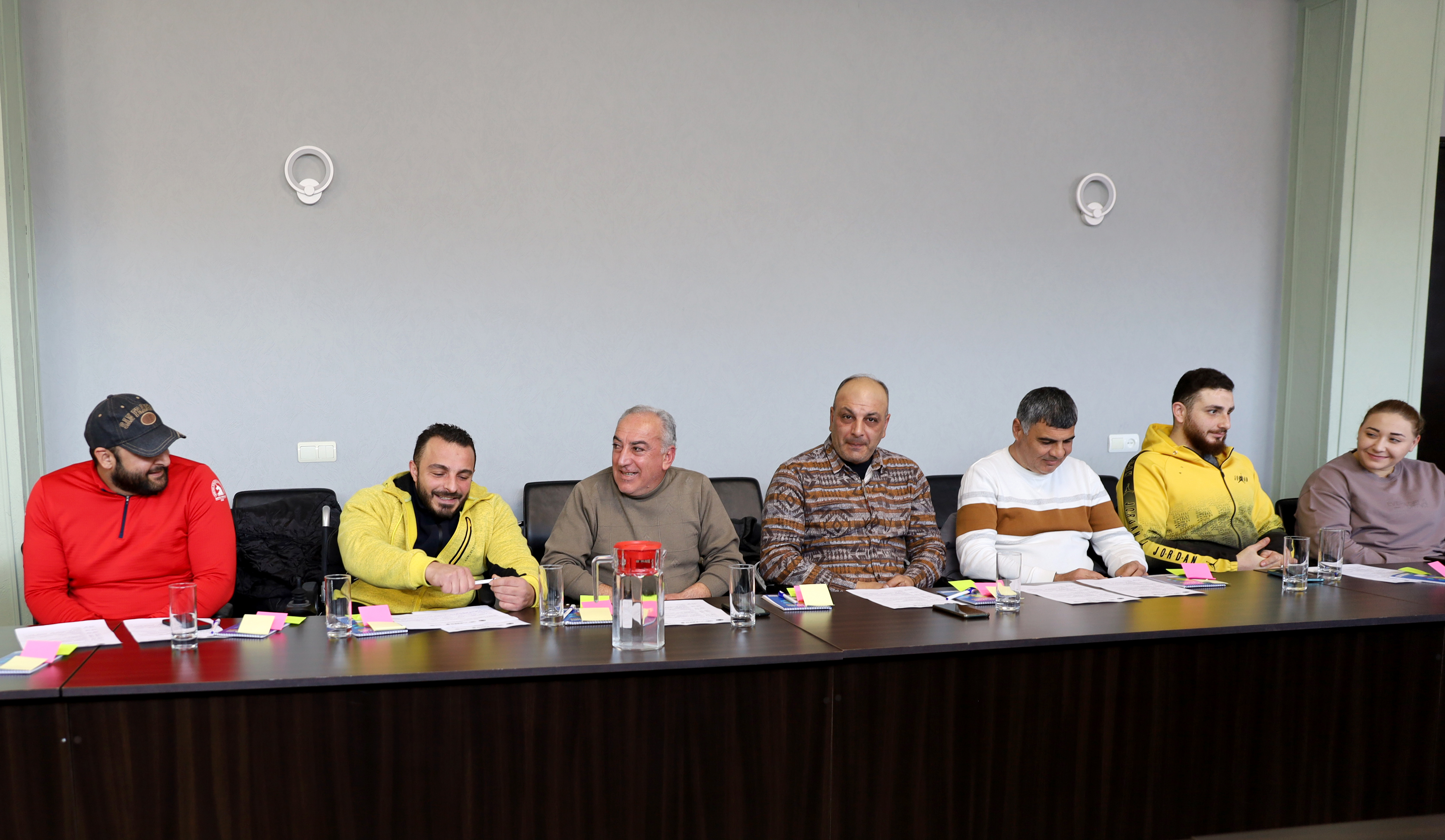 a photo where 7 participants are smiling 