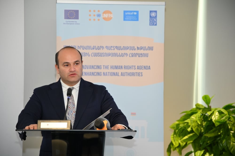 Minister Narek Mkrtchyan is speaking at a podium with the European Union, UNFPA, UNICEF, and UN logos in the background, at an event titled "Advancing the Human Rights Agenda by Enhancing National Authorities.