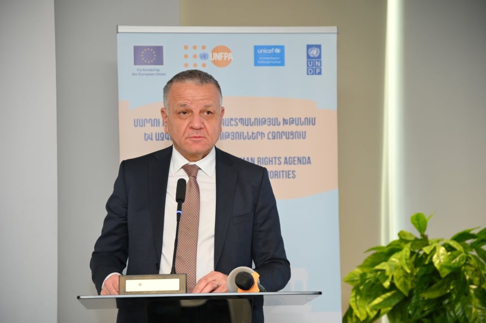 H.E. Mr. Vassilis Maragos, Ambassador, Head of the EU Delegation to Armenia is delivering opening remarks at a podium with the European Union, UNFPA, UNICEF, and UN logos in the background, at an event titled "Advancing the Human Rights Agenda by Enhancing National Authorities.