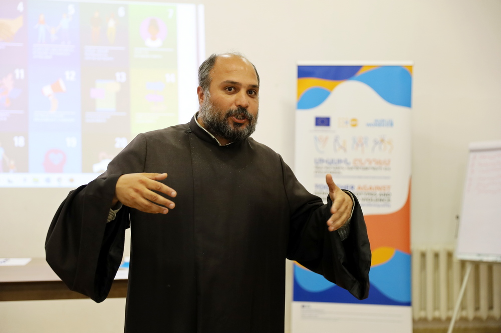 Father Makar Galamdaryan delivers a speech during the event.